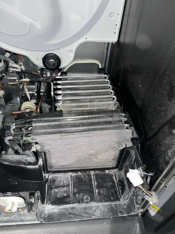 Lint-coated heat-pump dryer coils before service